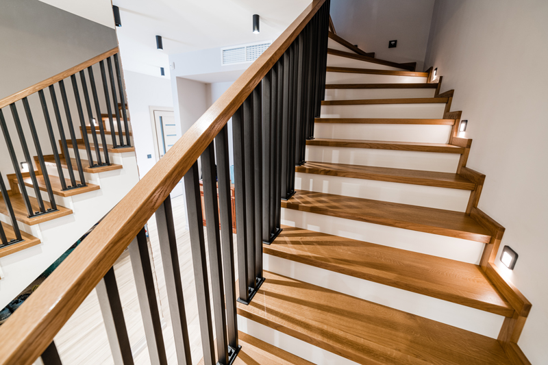 double stairs with wood treads-railings and black iron balusters